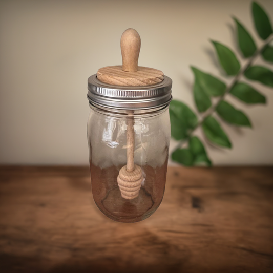 wooden honey dipper in glass